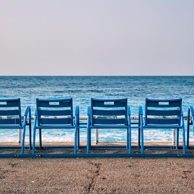 Famous blue chairs on beach of Nice, France